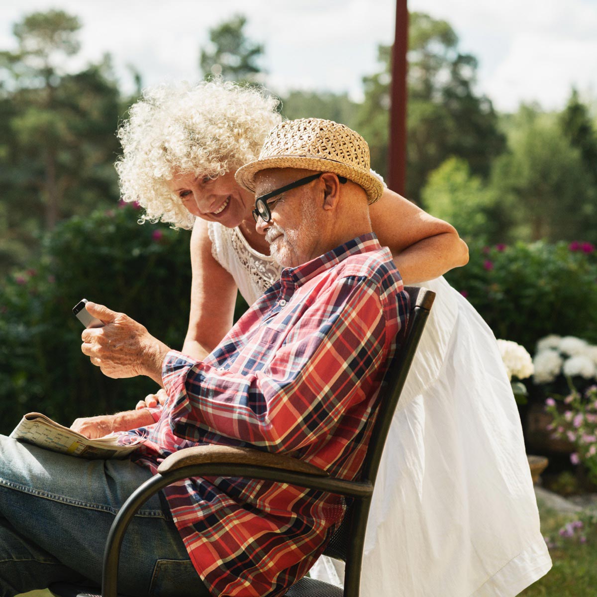 A man and a woman on the smartphone reads information about sustainability